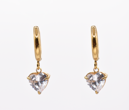 18k gold heart dangle hoop earrings with crystal charm on white background

