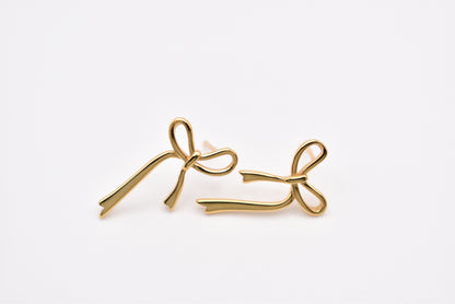 Gold bow earrings made from 925 sterling silver on white background