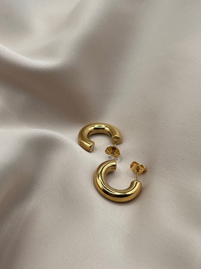 18k gold plated hoop earrings styled on satin